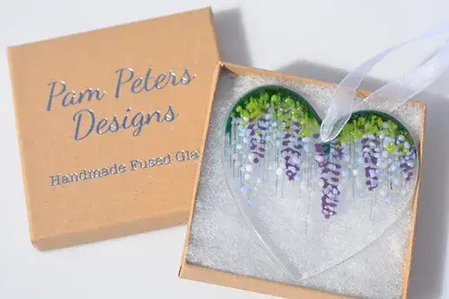 Glass heart with wisteria motif fused.
