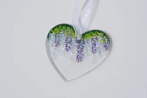 Glass heart with wisteria motif fused.