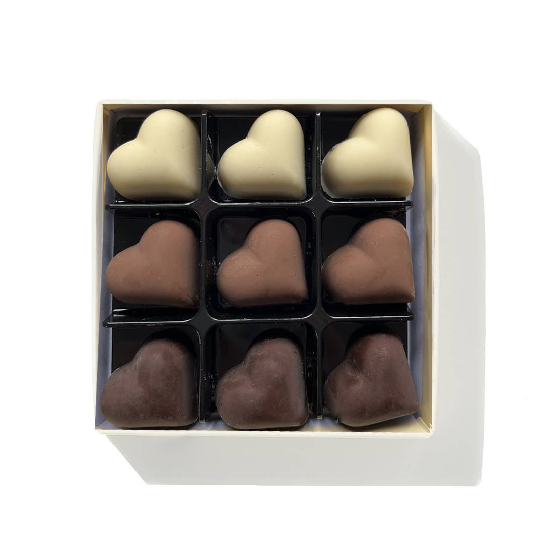 Handmade Belgium Chocolate hearts in milk, white and dark chocolate.