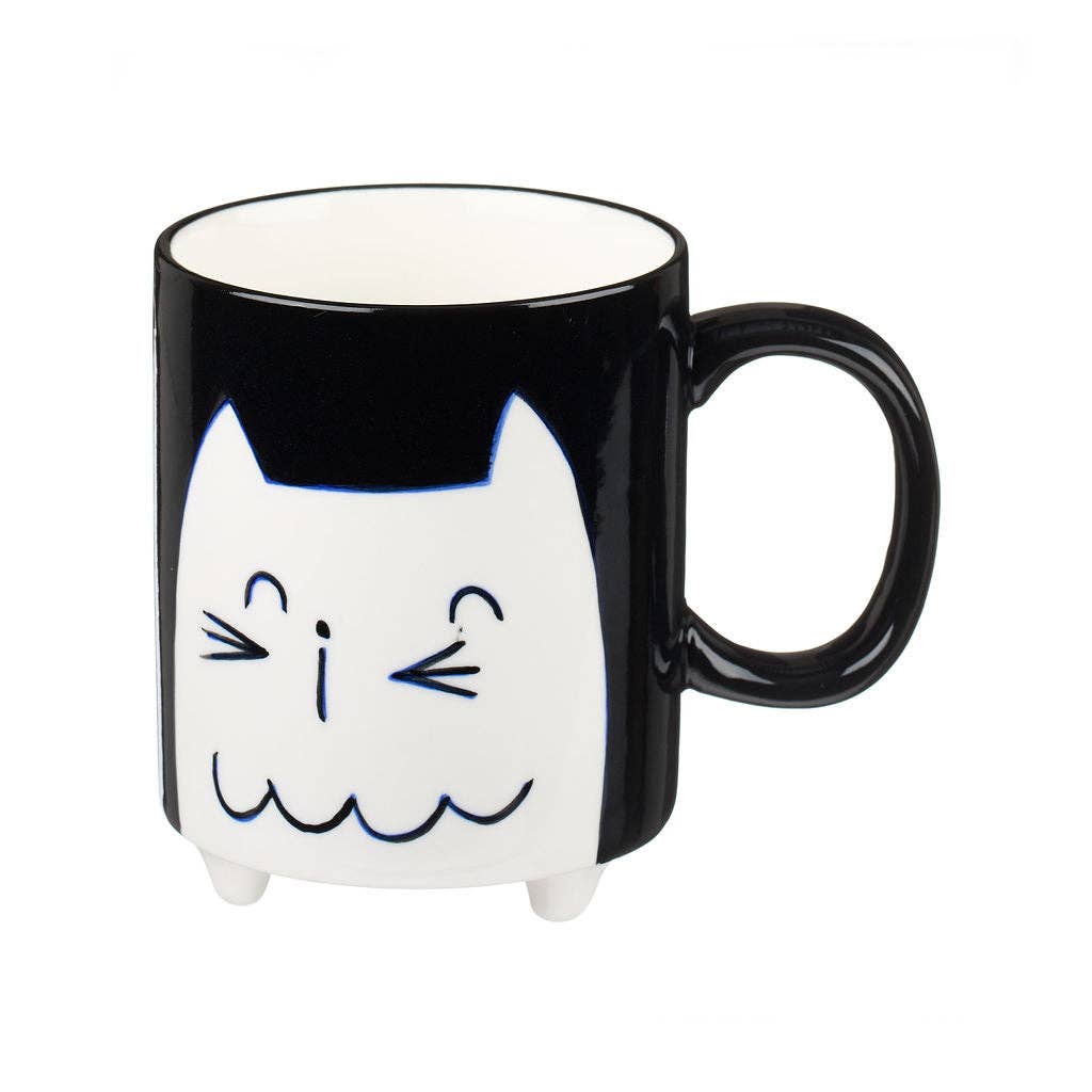 Cat-shaped mug with a black and white design on a white background