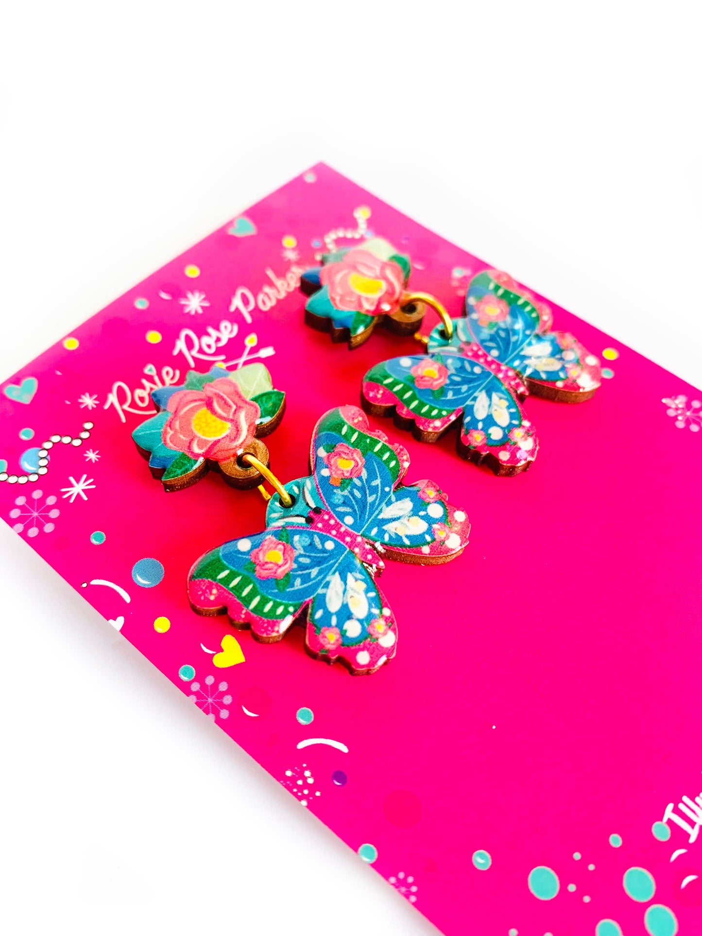 Floral and butterfly wooden and enamel earrings.