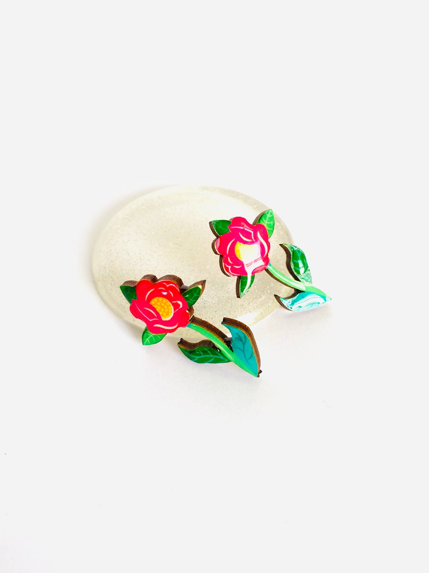 Resin and wooden flower earrings with stem.