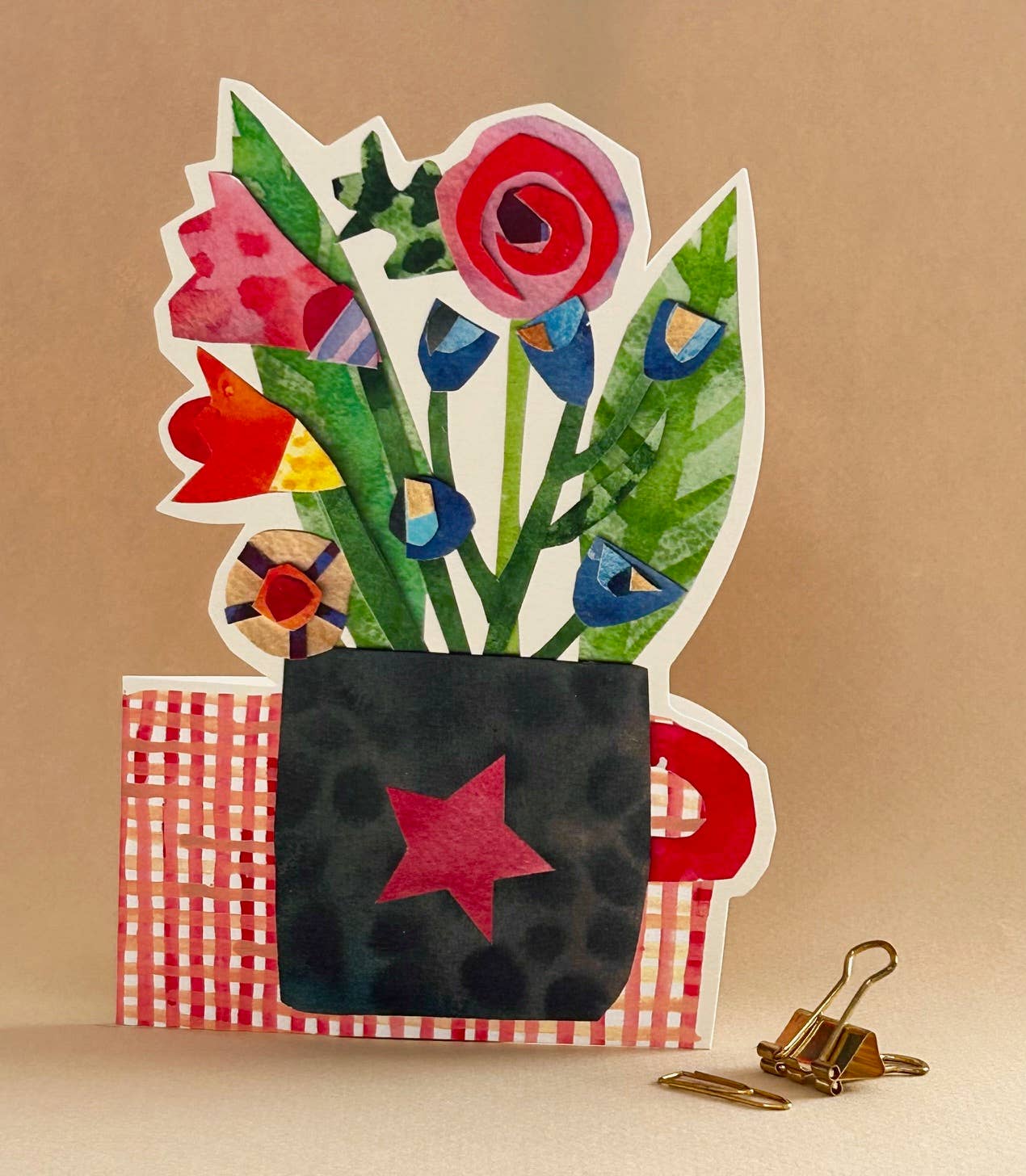 Cut out card flowers in a cup. Card blank inside.