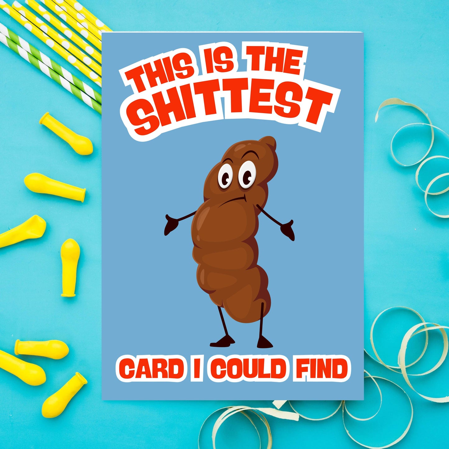Card with cartoon poop character and humorous text on a blue background with party supplies.