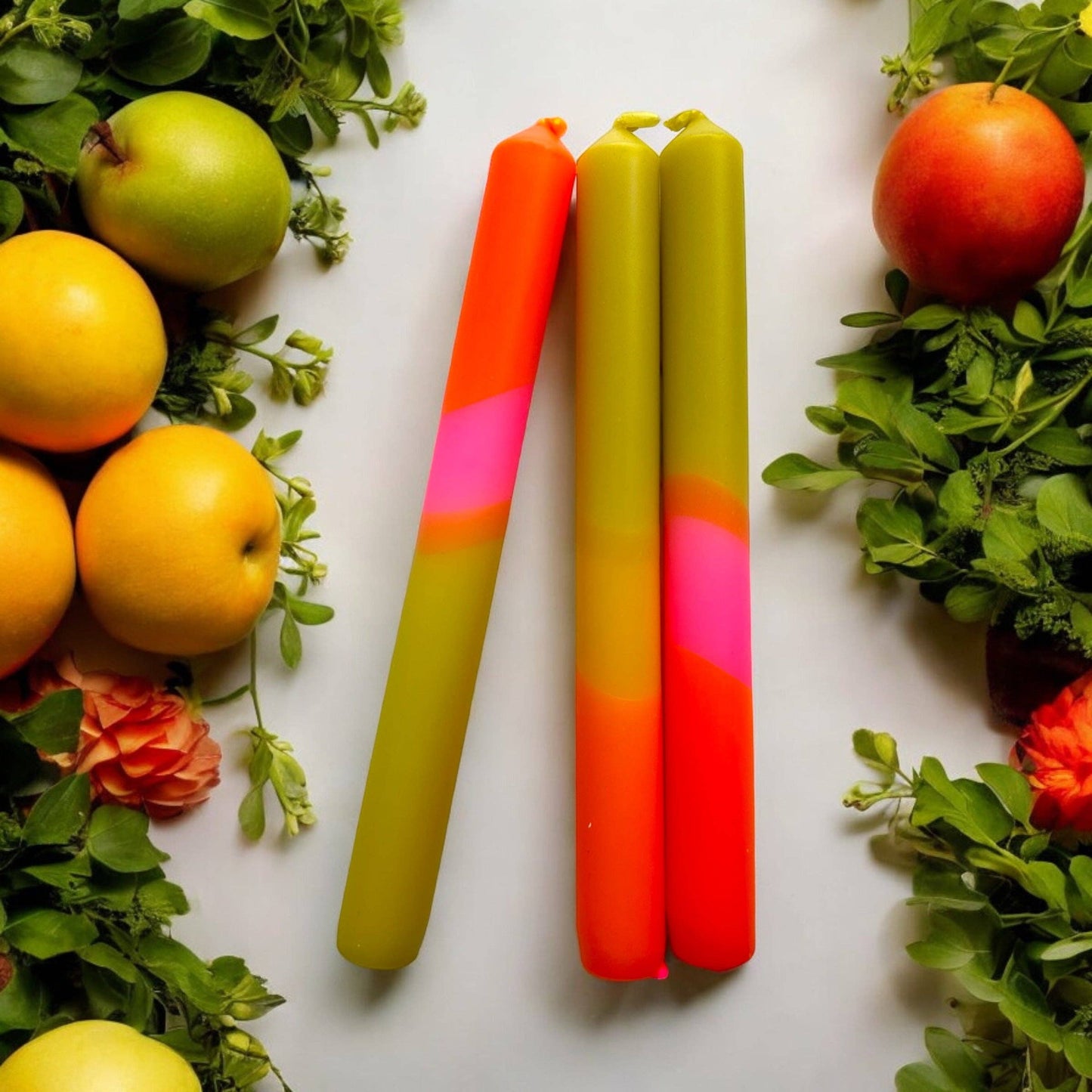 Trio of dinner candles. 70s inspired colours, olive green, orange and pink.