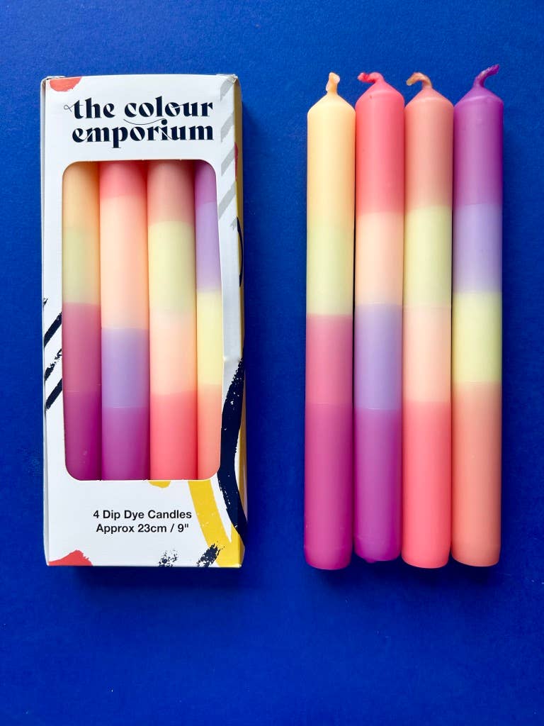 Set of 4 table candles. pastel colours of lemon yellow, peach, lilac and apricot.