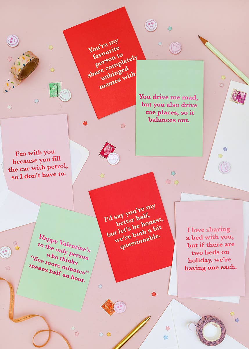 Valentine's Day cards with humorous text on a pink background