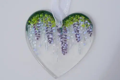 Glass heart with wisteria motif fused.