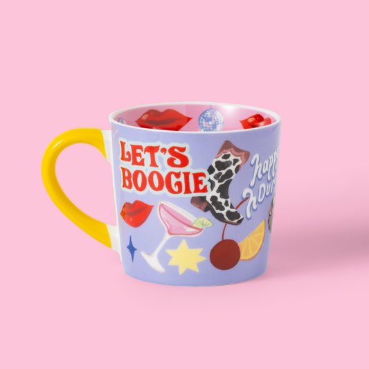 Colorful mug with 'Let's Boogie' text on a pink background