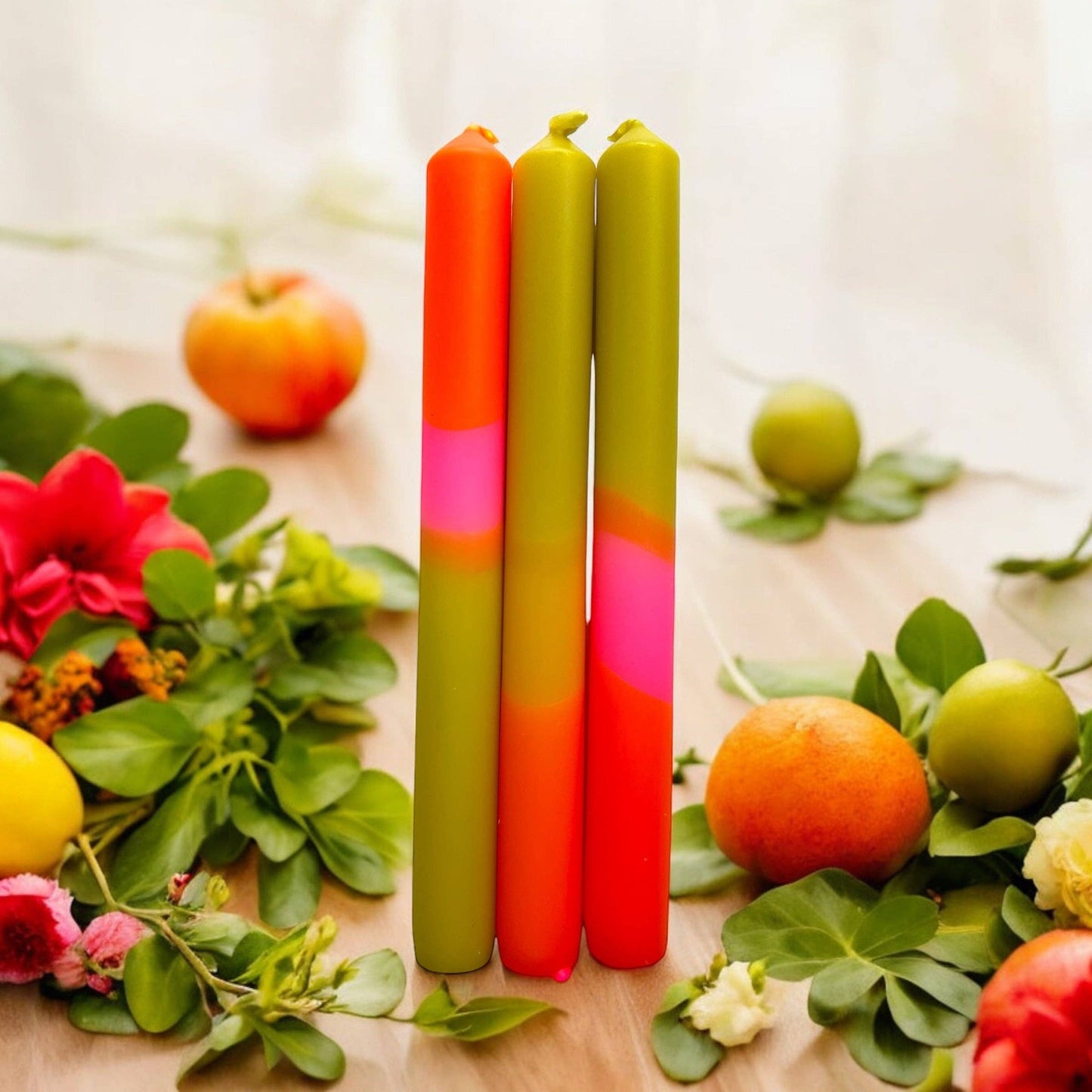 Trio of dinner candles. 70s inspired colours, olive green, orange and pink.