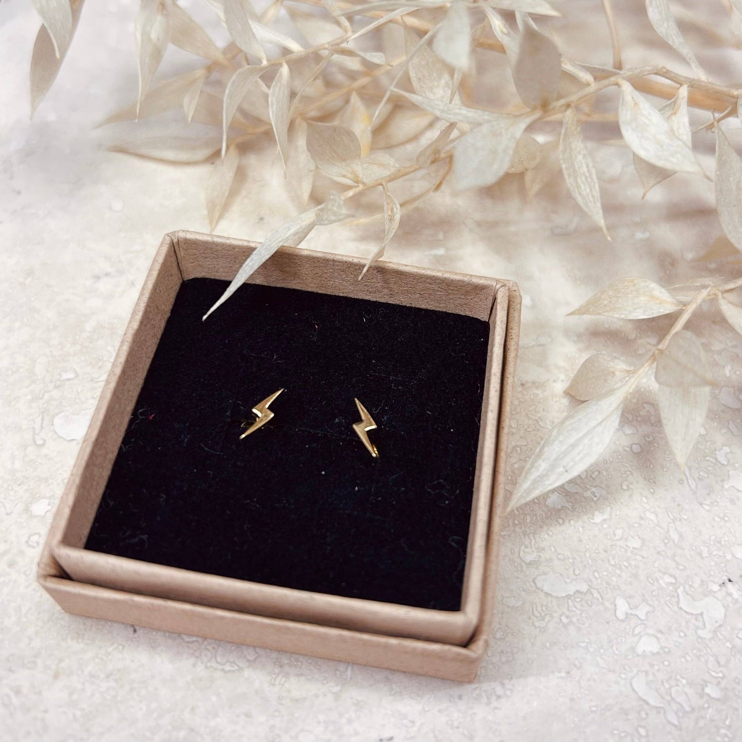 Mini lightening bolt studs in gold or silver.