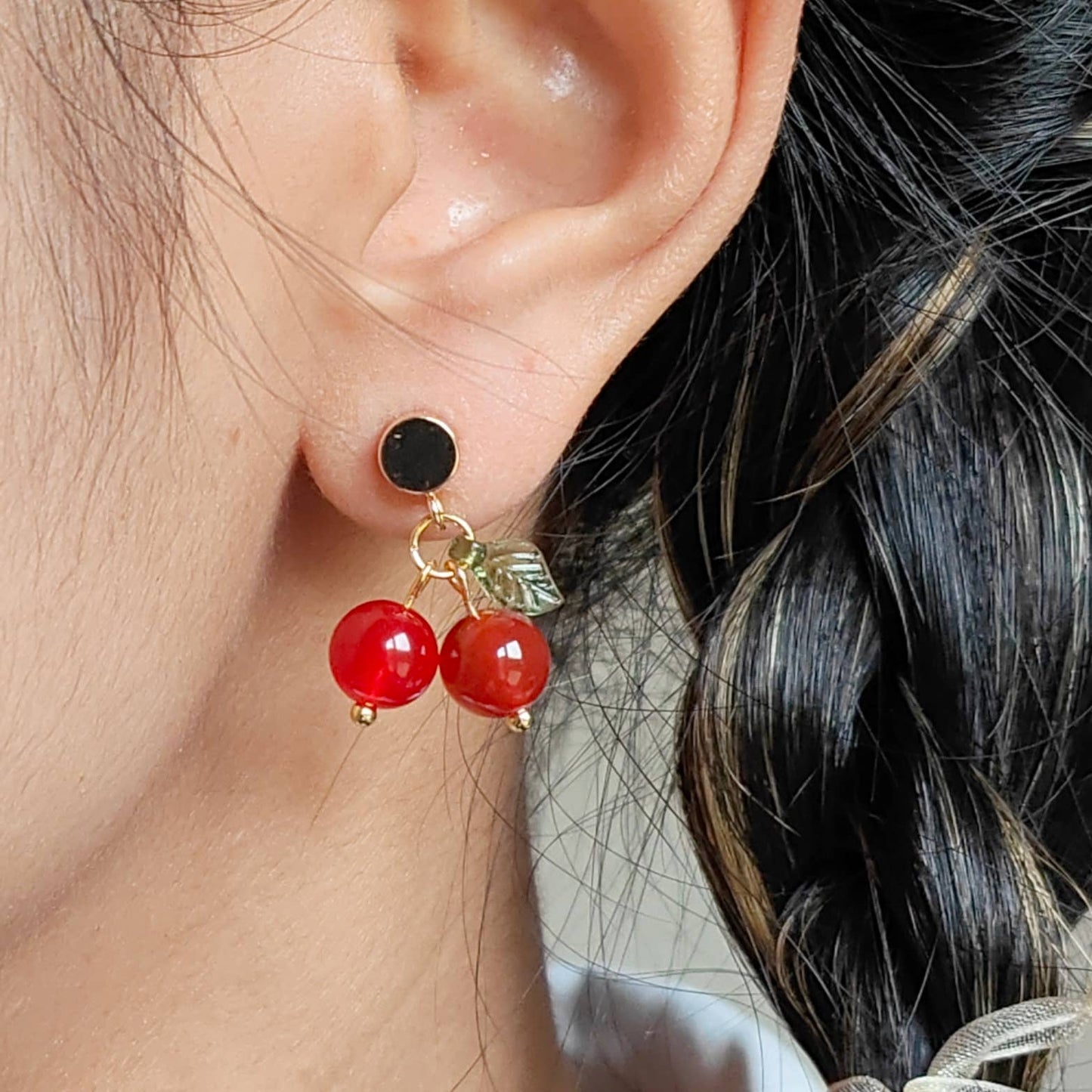 red ruby gem stone on gold plated stud.