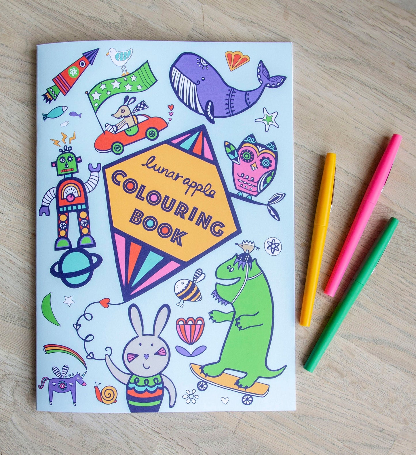 A colouring book titled "Lunar Apple Colouring Book", surrounded by colourful drawings.