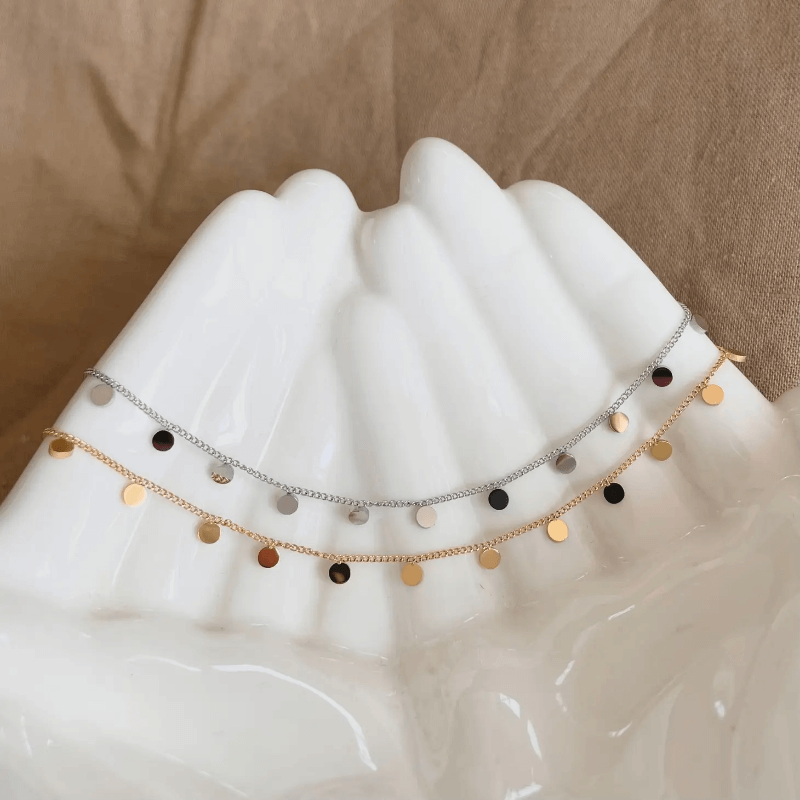 Polished gold or silver plated mini circle chain necklace.