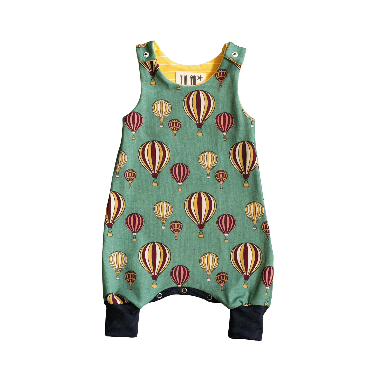 Baby sleeveless romper suit. The fabric is balloons on a green background.