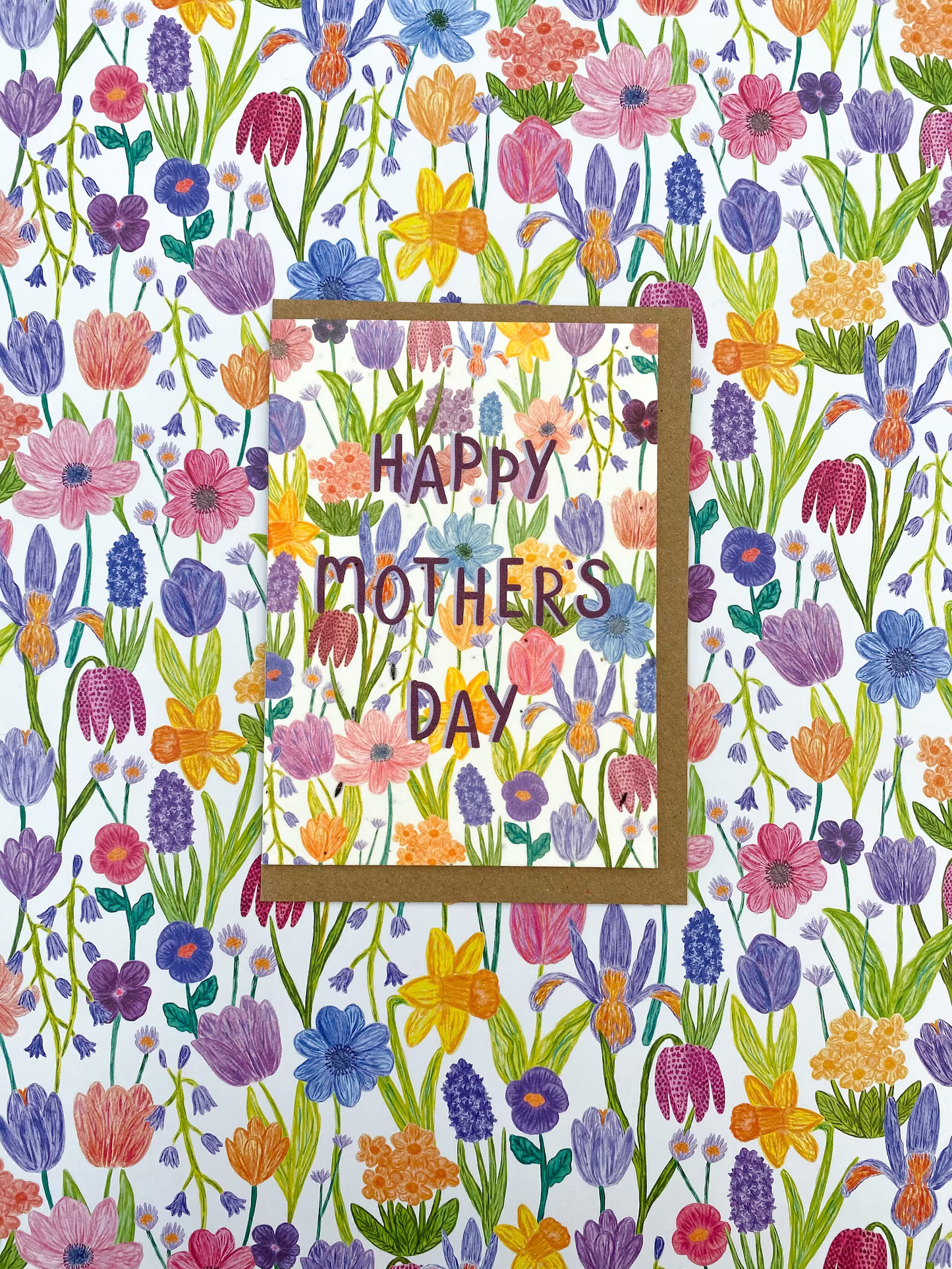 Mothers Day Cards with spring flower illustration covering card and printed on seed embedded paper.