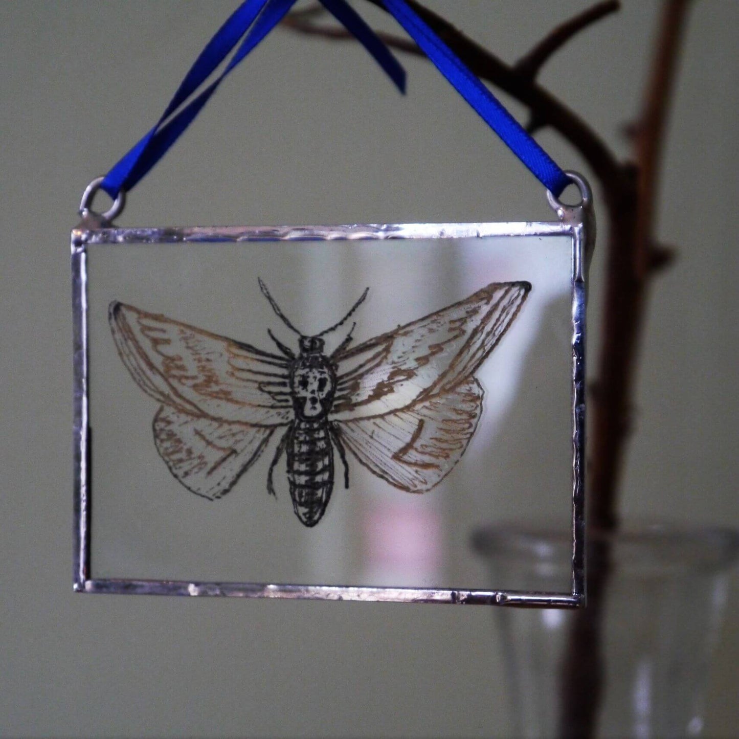 The Corbeau Press Moth With Skull Hanging