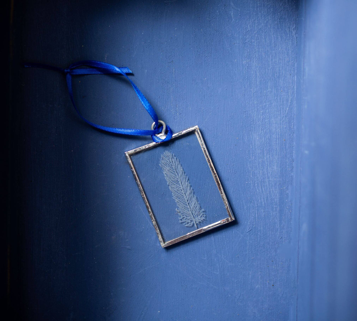 The Corbeau Press Feather Hanging