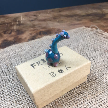 Sue Webb Friends in a box glass Dinosaur.