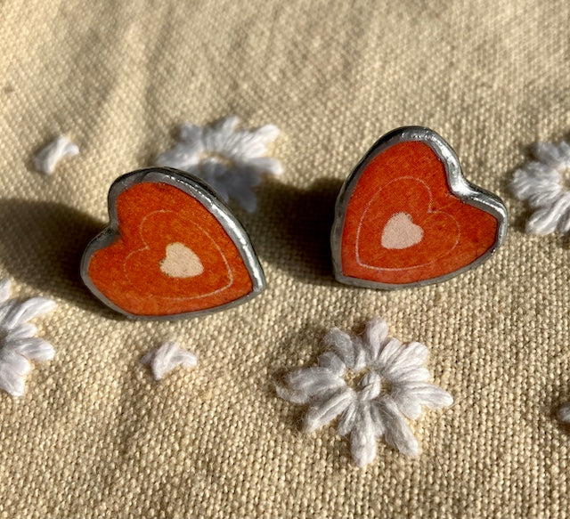 Quirky red earrings, handmade in Cardiff. Layered paper, metal and resin.