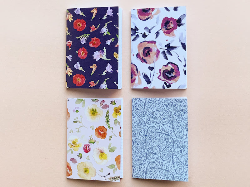 Thea & Fox Pack of 4 small notebooks. 3 x floral designs and one pretty paisley design.