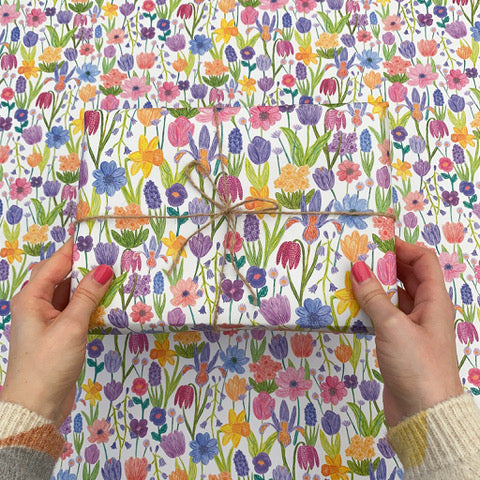 Wrapping paper with colourful flowers on white background