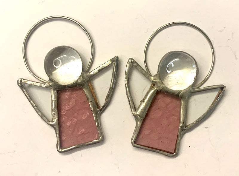 Stained Glass Angels. Individually made by hand. Many colour choices and variations. A choice of a clear or amber nugget head. The glass texture may vary slightly from the photographs. The clear glass wings will vary in texture too. Size 5cm x 7cm including halo. Glass is cut to shape and copperfoiled, followed by soldering all the pieces together. Handmade by Dadswell Glass at Glass Designs in Bristol.