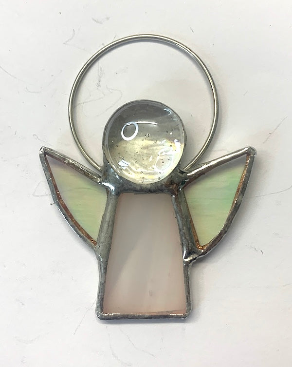 Stained Glass Angels. Individually made by hand. Many colour choices and variations. A choice of a clear or amber nugget head. The glass texture may vary slightly from the photographs. The clear glass wings will vary in texture too. Size 5cm x 7cm including halo. Glass is cut to shape and copperfoiled, followed by soldering all the pieces together. Handmade by Dadswell Glass at Glass Designs in Bristol.