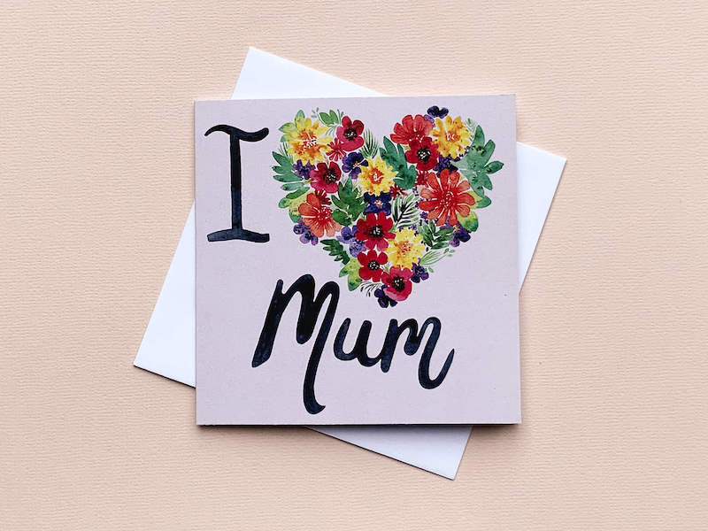 I heart Mum Eco card Tell your mum you love her with a heart full of flowers. This pretty Eco friendly card features watercolour florals and hand painted script. Card size-125x125mm Envelope size-130x130mm All cards are left blank on the inside for your own message.