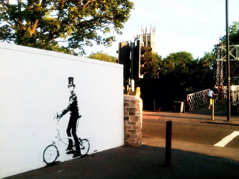 Glass Designs Stewy Unframed Brunel on a Bike Print. Black and white illustration. Print taken from life size stencils from Bristol street artist Stewy.