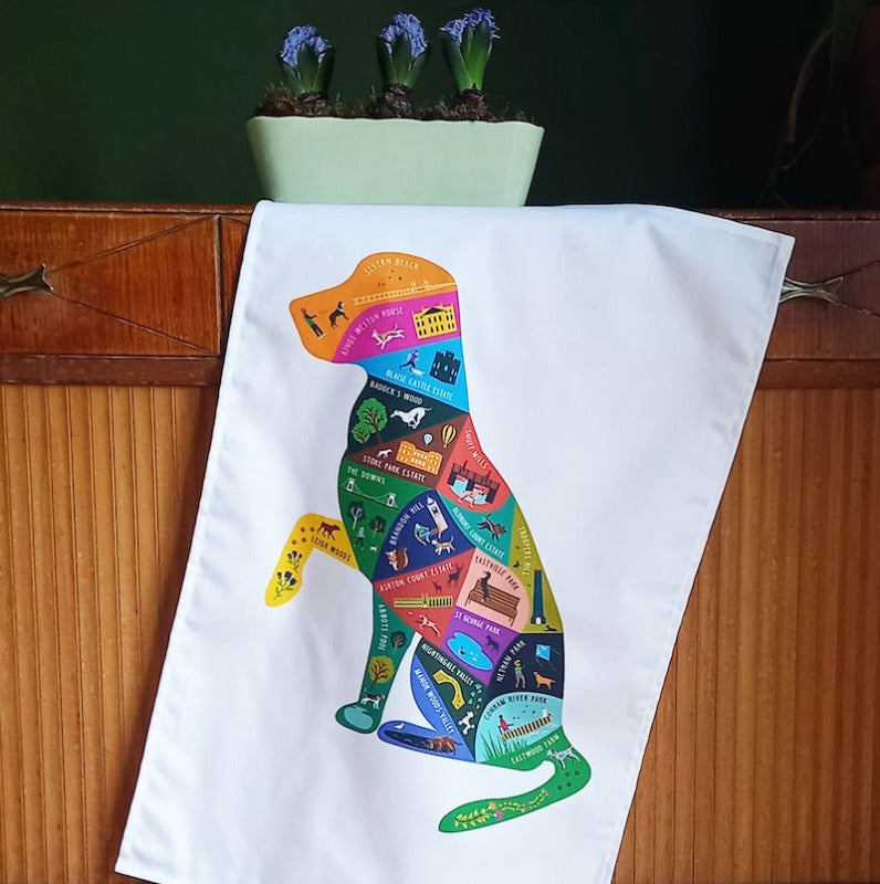 Colourful T towel depicting a dog shaped map of popular dog walks s in Bristol