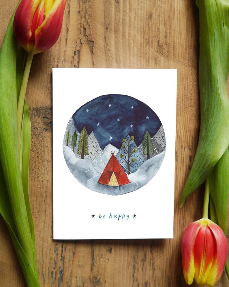 card with round watercolour of mountains dark sky and a tent with the words ''Be Happy''