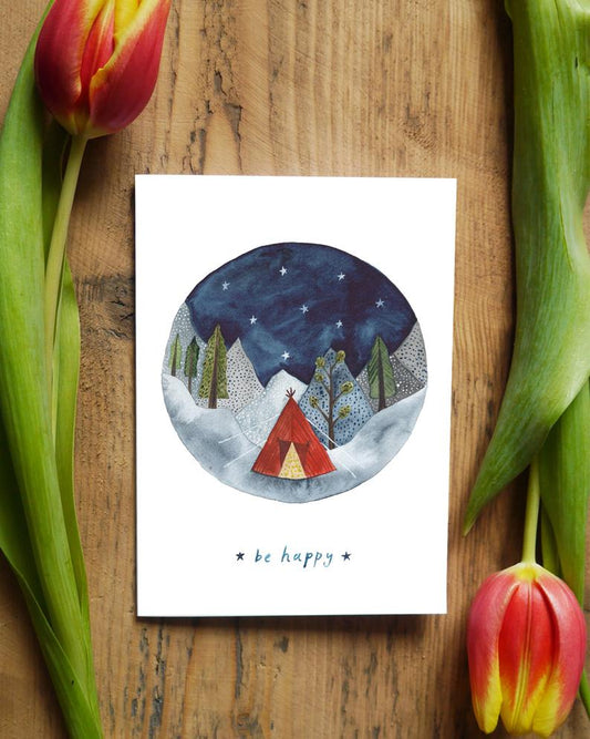 card with round watercolour of mountains dark sky and a tent with the words ''Be Happy''
