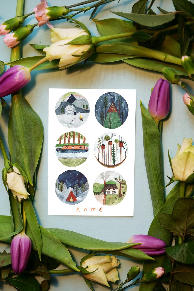 watercolour greetings card with homes of the world and the words ''home''