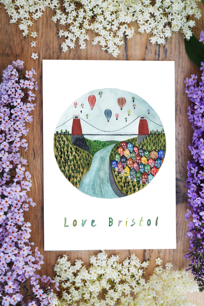 watercolour greetings card with design of Bristol Bridge, Hot air ballons and colourful houses with the words ''love Bristol''