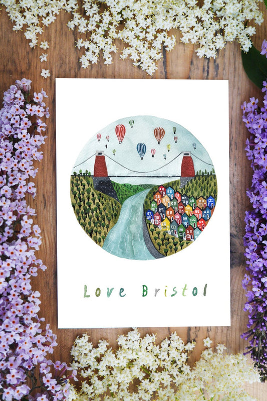 watercolour greetings card with design of Bristol Bridge, Hot air ballons and colourful houses with the words ''love Bristol''