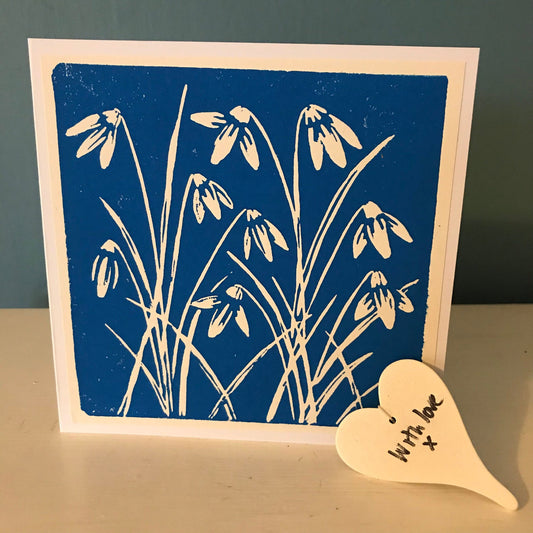 A beautiful handprinted linocut of Snowdrops, in cyan blue or magenta.  A handmade greetings card for any occasion, left blank inside for your own message.