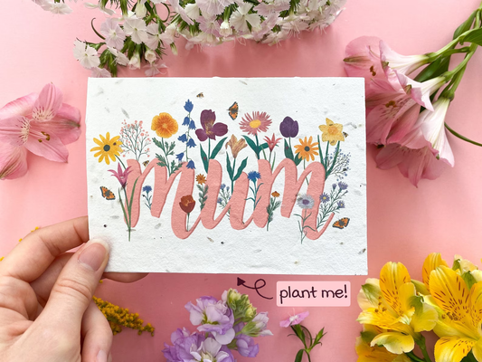 A card with wildflower seeds enbedded in the paper, with a beautiful floral design with the words mum, a lovely mothers day card