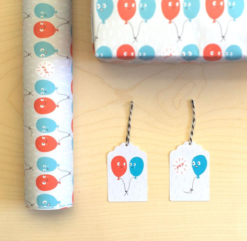 Sarah Ray Whimsical Wrapping Paper. Blue and Red Party Balloons with smiling faces. Suitable for Birthday and Celebrations. Edit alt text