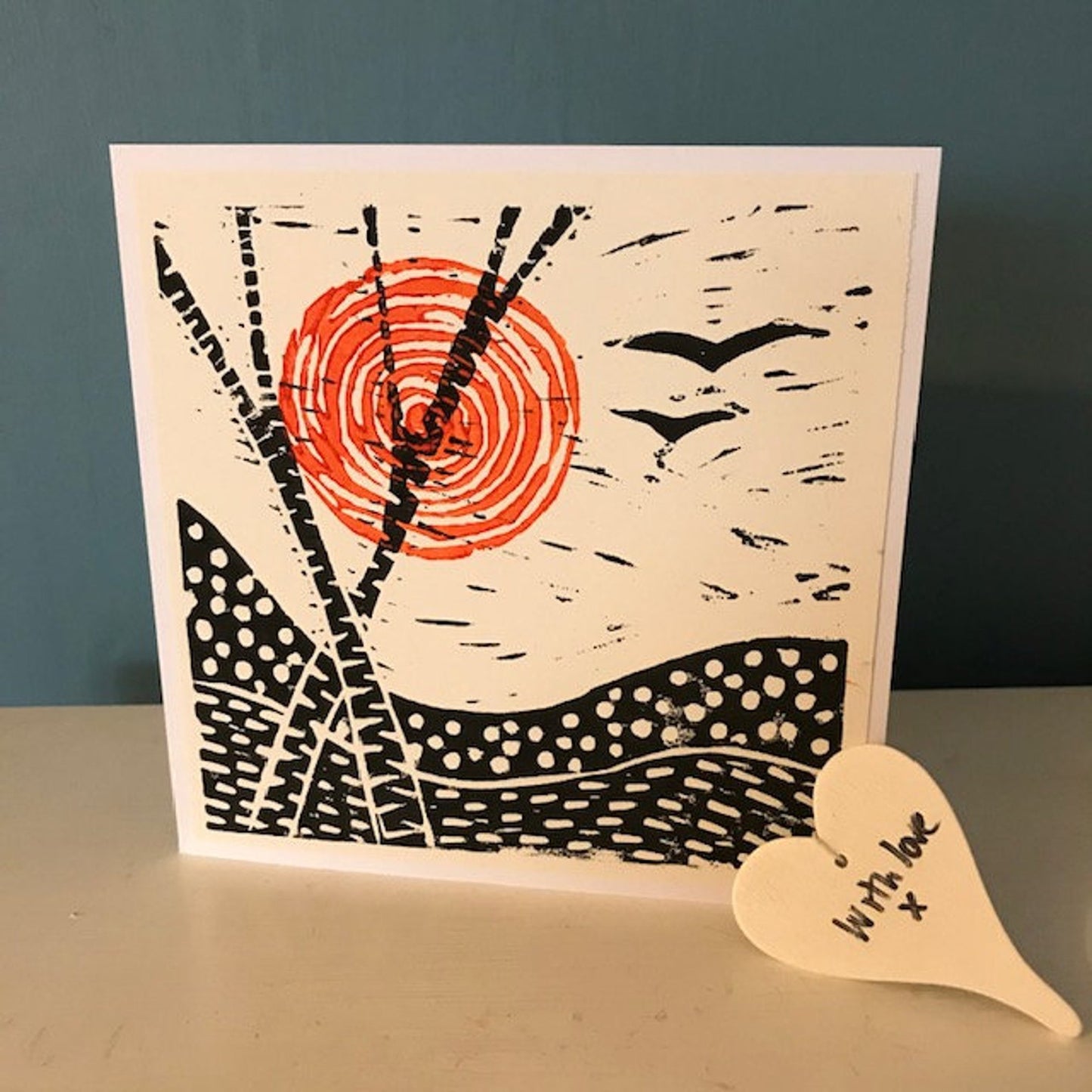 Handprint Lino Cut, with a red sun, trees and birds. Handmade in Bristol. Greetings card for any occasion. Blank inside.