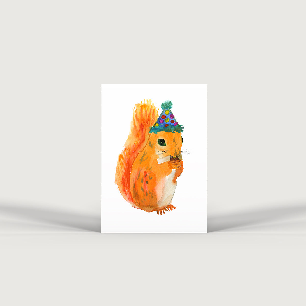 Bristol based water colour illustrator Rosie Webb squirrel in a party hat. Edit alt text