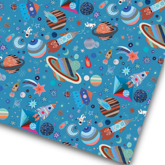 Wrapping paper with colouful space rockets and planets on medium blue background
