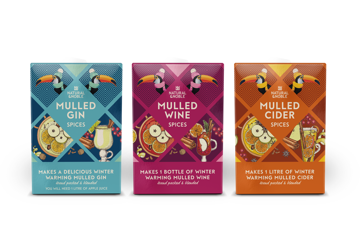 Three boxes of mulled wine spices with colorful designs on a white background