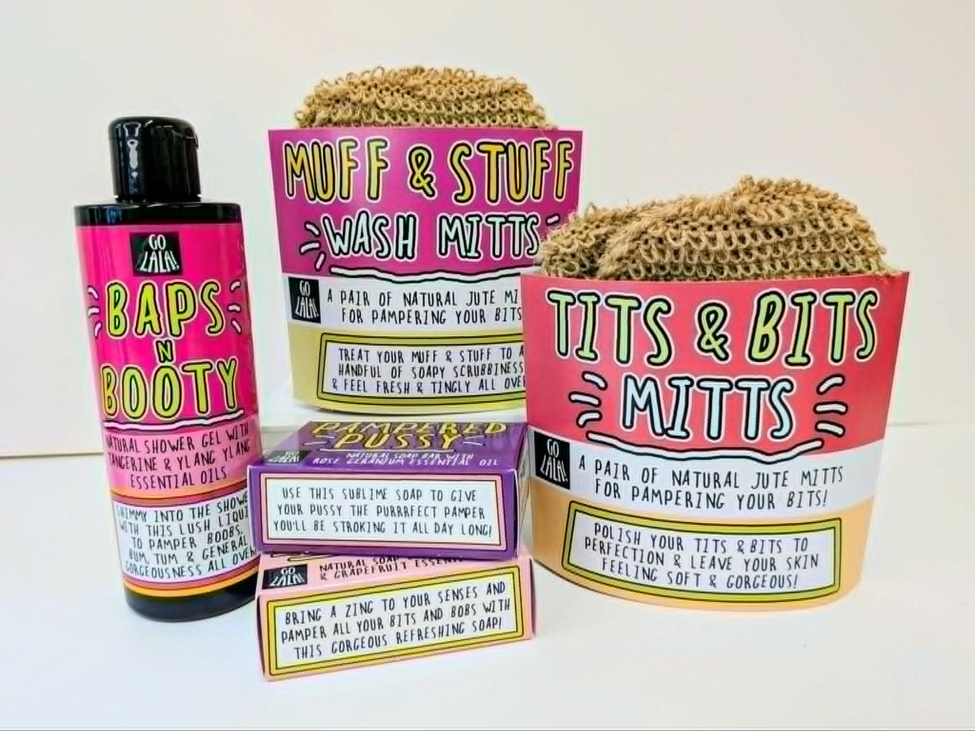 Product packaging with 'Muff & Stuff Wash Mitts' and 'Tits & Bits Mitts' on a white background