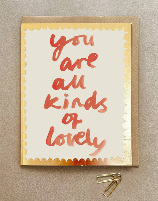 In red water colour paint You are all kinds of Lovely on a cream card with gold embossed edging.