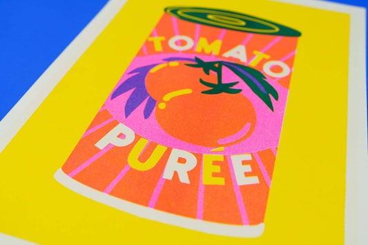 Surrealistic depiction of a can labeled 'Tomato Puree' on a colorful background