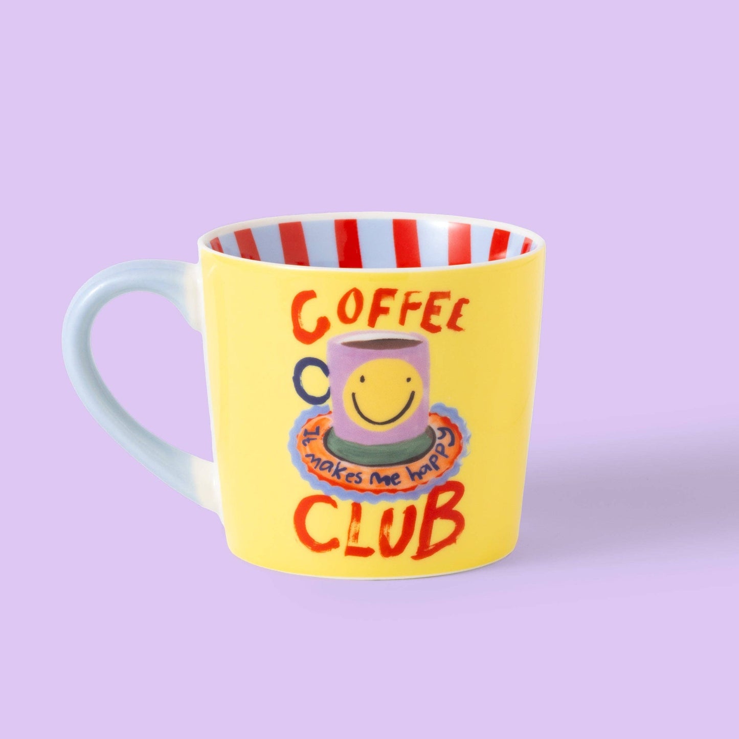 Yellow mug with a smiley face design and text on a purple background