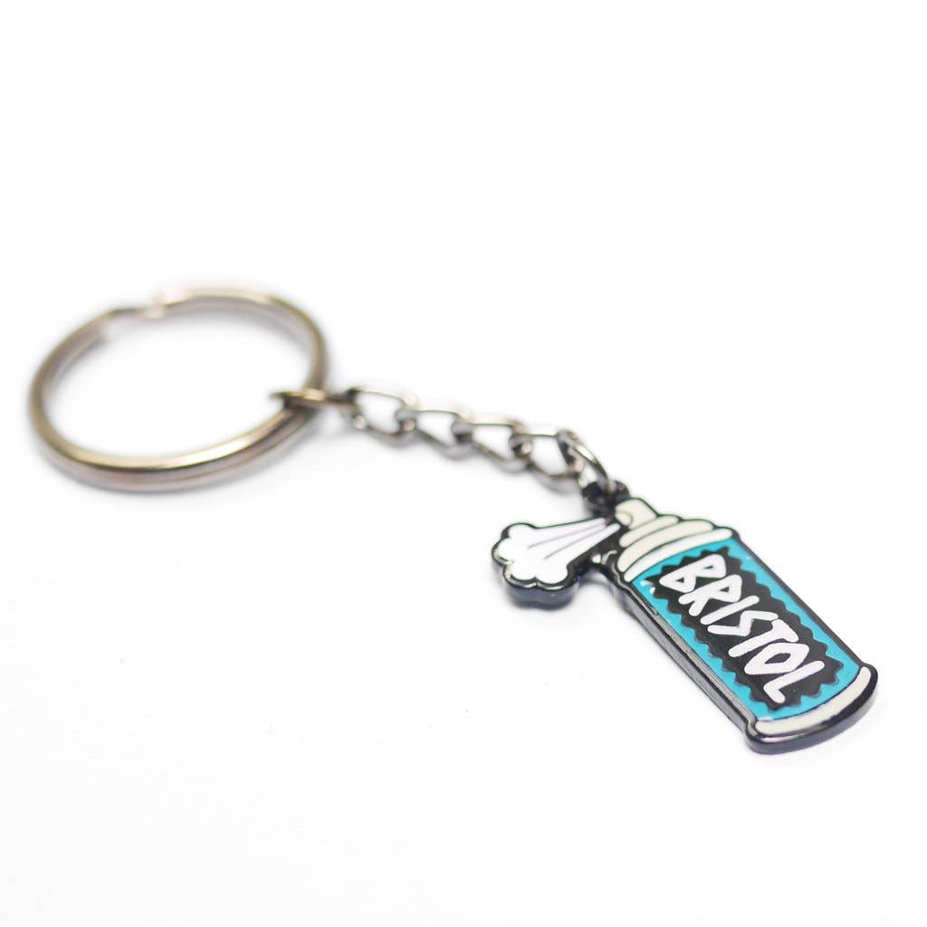 Keychain with a spray paint can design on a white background