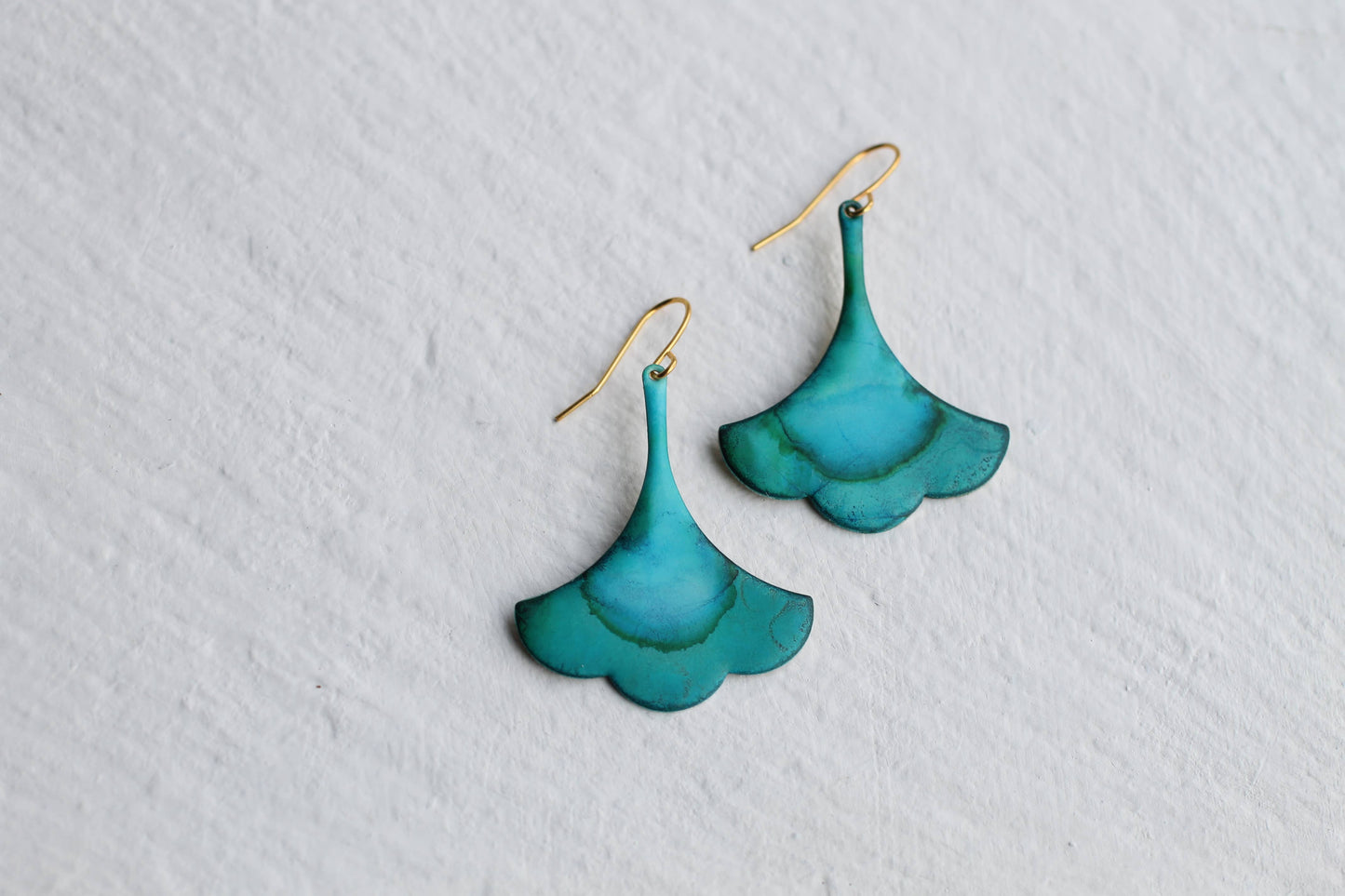 Turquoise earrings on a light gray background