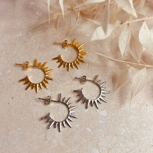 Mini gold or silver stud hoops with replicating sun rays.